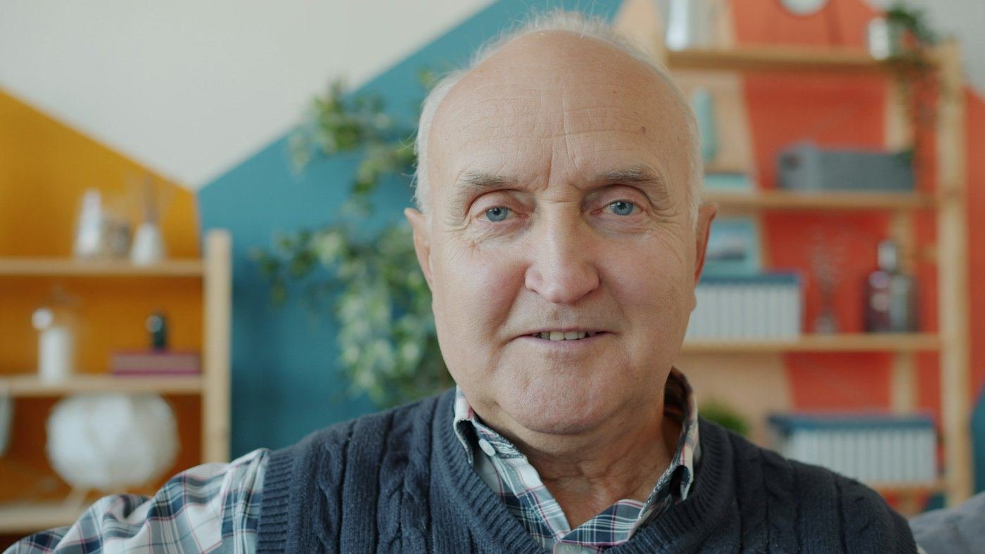 Smiling older man at home